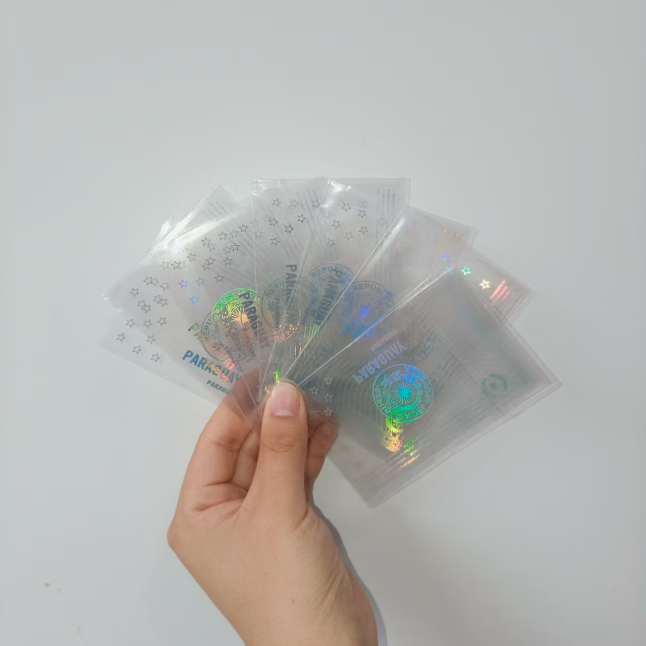 ສະຕິກເກີບັດ hologram ທີ່ໂປ່ງໃສ